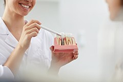 Dentist discussing the process of dental implants