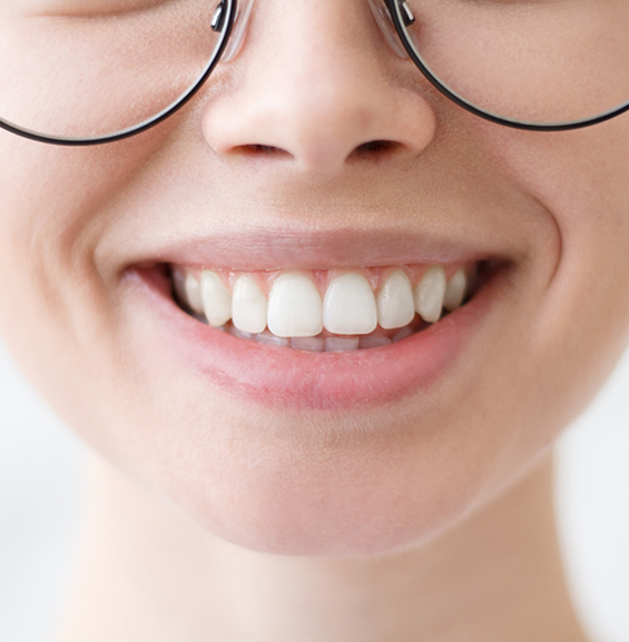 Close up of a person with flawless teeth smiling