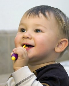 A toddler practicing their brushing routine.