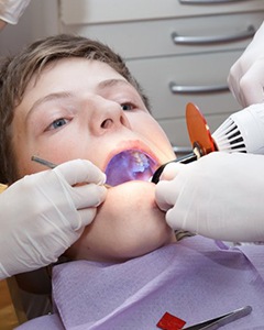 A child receiving dental sealants