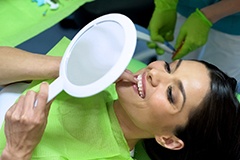 A woman happy with the results of her cosmetic dentistry