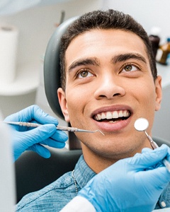 dentist examining a patient’s mouth