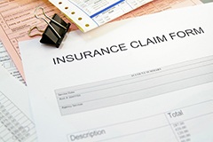 Insurance claim form on loose papers
