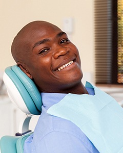 Smiling man in dental chair visiting his Allentown dentist