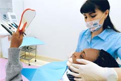 Woman at dentist for consultation