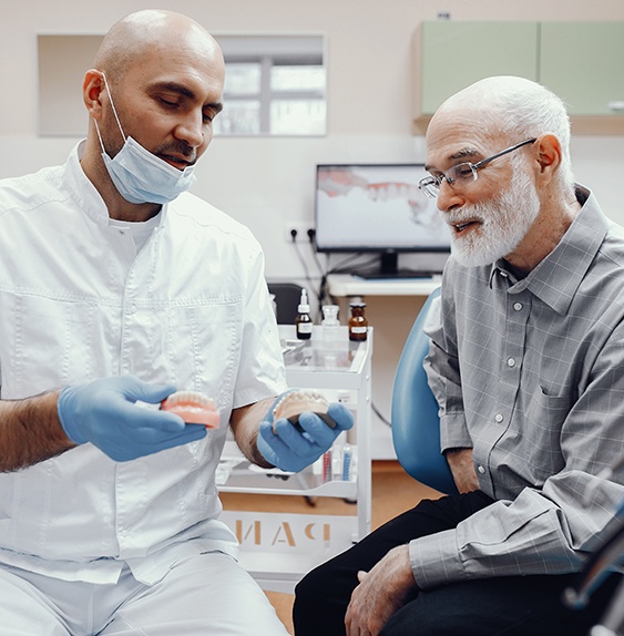 Implant dentures are permanent prosthetics that secure in place with dental implants