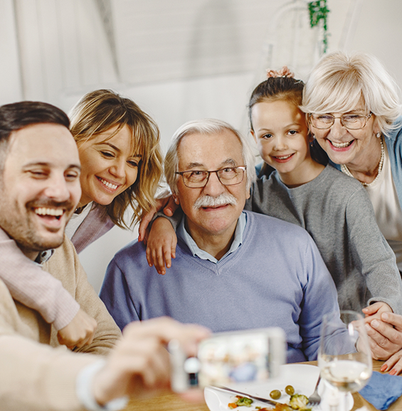 Three generations of a happy family at dinner