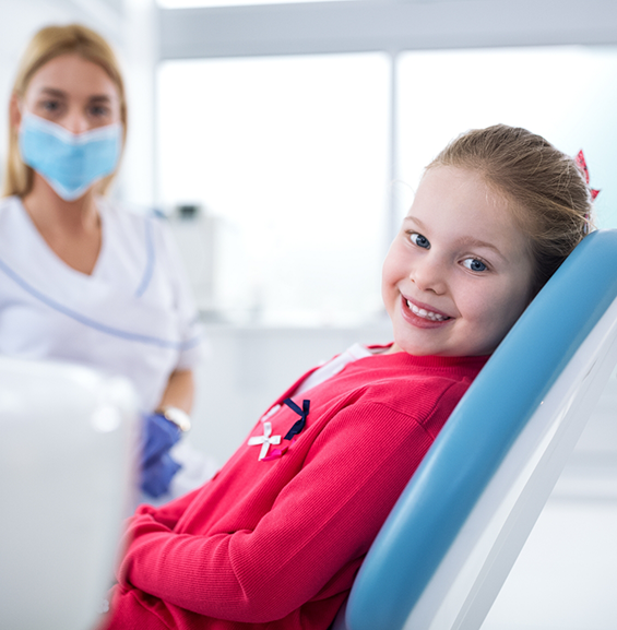 Young girl smiling in the dental chair