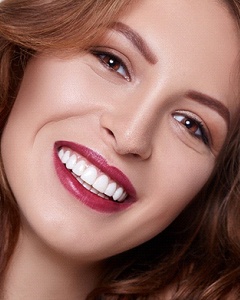 Woman with a beautiful smile using veneers