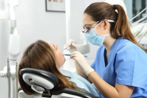 woman sitting in dentist chair 