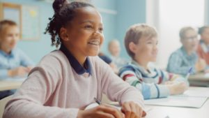 Child smiling in classroom