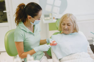 Woman at dentist for denture consultation